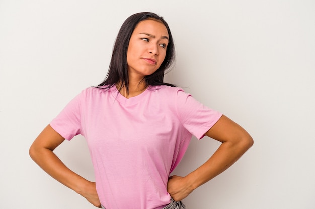 Young latin woman isolated on white background  dreaming of achieving goals and purposes