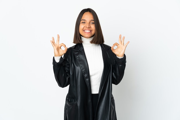 Young latin woman isolated on white background in zen pose