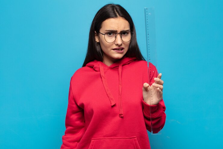 फोटो young latin woman looking puzzled and confused, biting lip with a nervous gesture, not knowing the answer to the problem