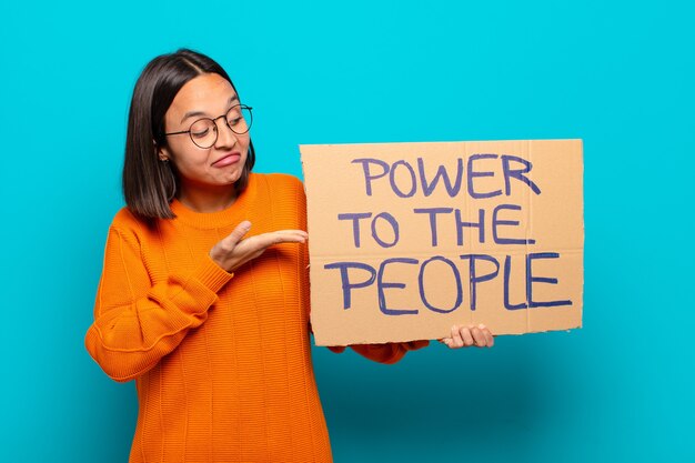 Photo young latin woman. power to the people concept