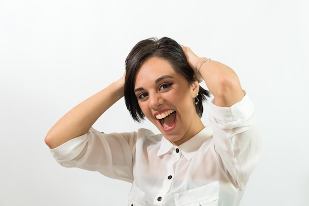 young latina girl, very euphoric, happy, holding her head.