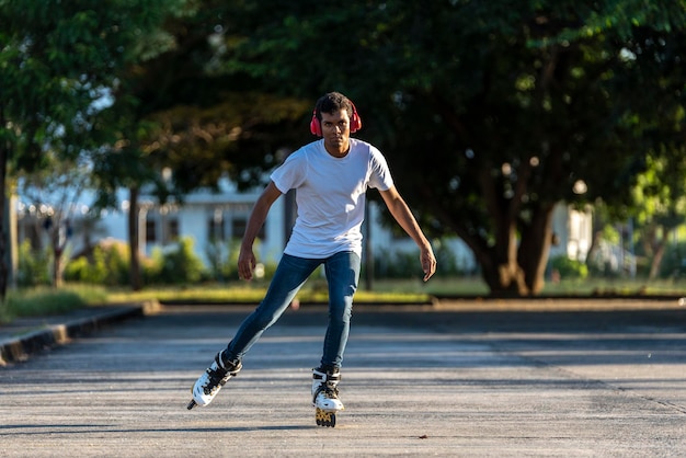 Young latino man exercising on rollerblades, Panama, central America