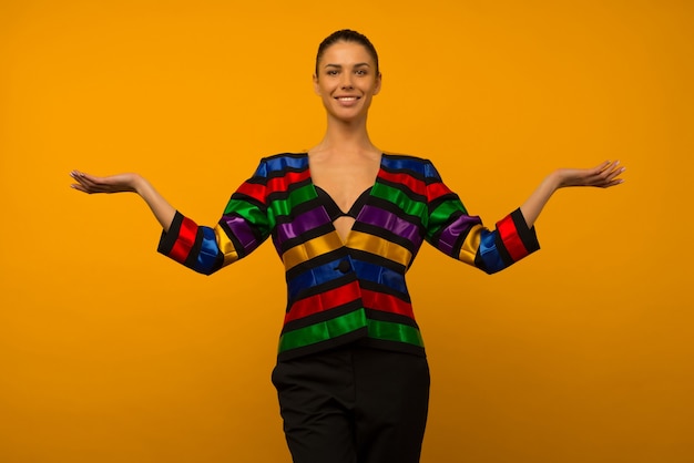 Young lesbian girl and an LGBT community representative posing in a flag coloring jacket LGBTQ shows something 