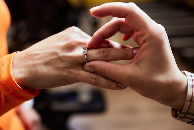 Young lesbian woman proposing to her girlfriend