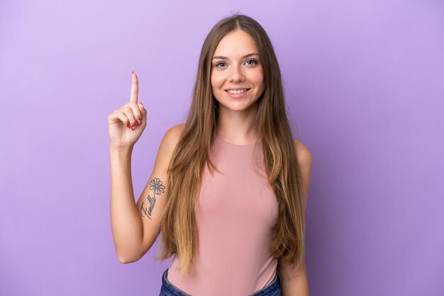 Young Lithuanian woman isolated on purple background pointing up a great idea