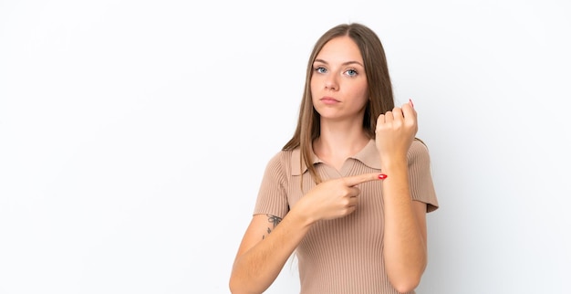 Young Lithuanian woman isolated on white background making the gesture of being late