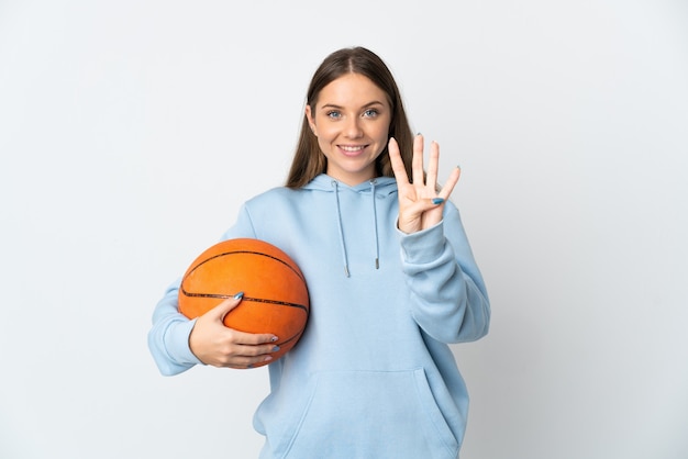 Young Lithuanian woman playing basketball isolated on white background happy and counting four with fingers