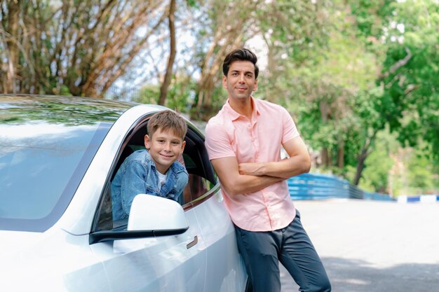 Young little boy enjoying family car adventure vacation with father Perpetual