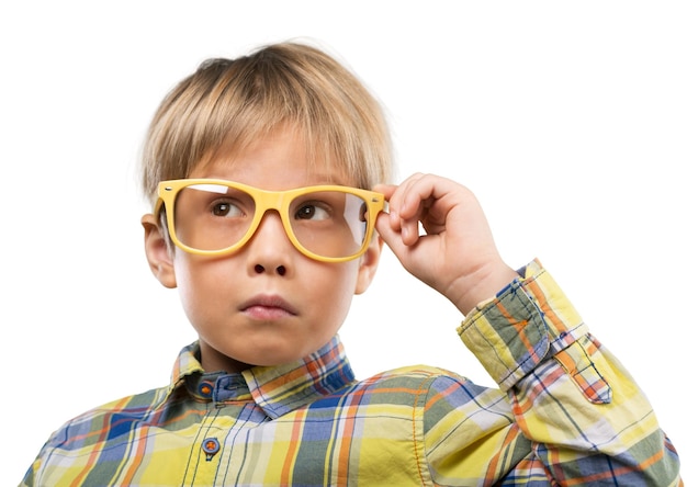 Young little boy with yellow glasses