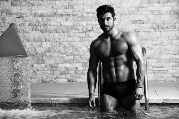 Young Looking Macho Man At Hotel Indoor Pool