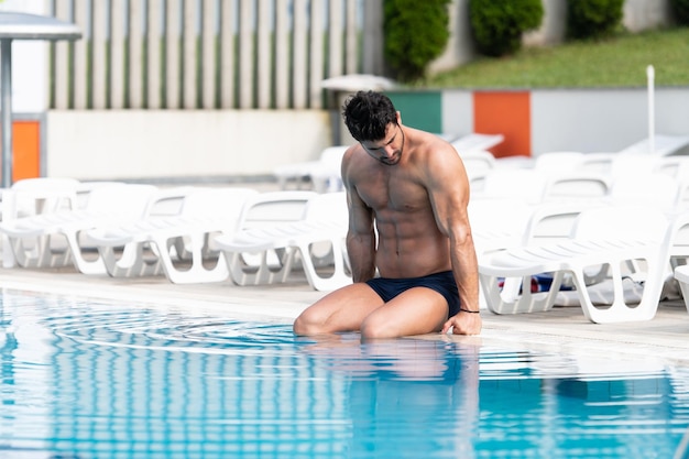 Young Looking Macho Man At Swimming Outdoor Pool