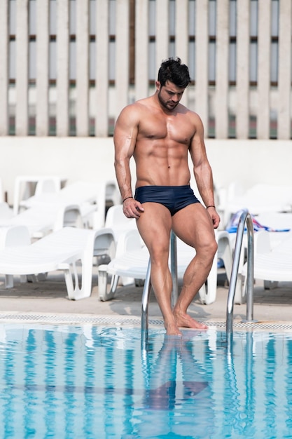 Young Looking Macho Man At Swimming Outdoor Pool