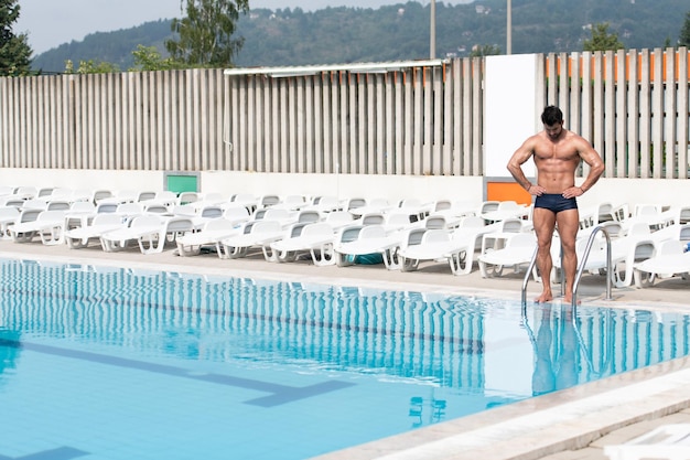 Young Looking Macho Man At Swimming Outdoor Pool