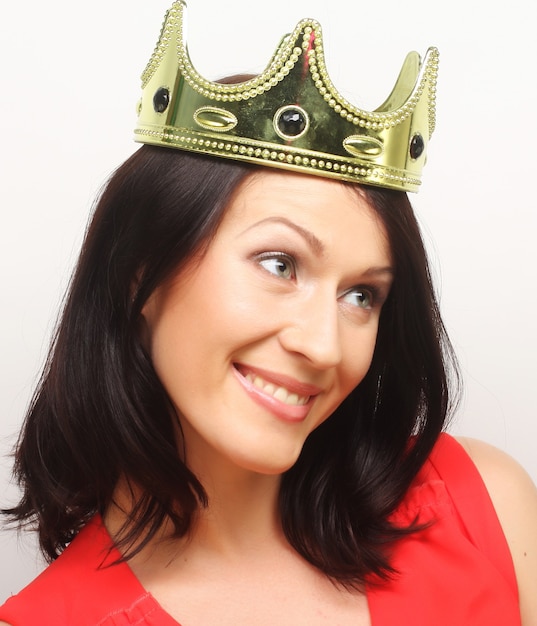 Young lovely brunette woman in crown