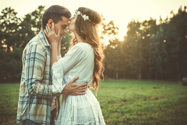 Young lovely couple at sunset