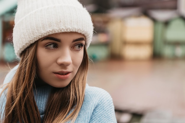 Young lovely pretty woman standing street in winter holiday