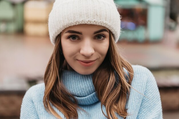 Young lovely pretty woman standing street in winter holiday