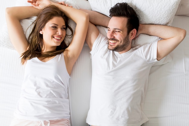 Young loving couple in the bed