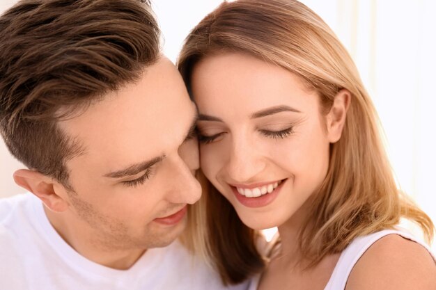 Young loving couple indoors