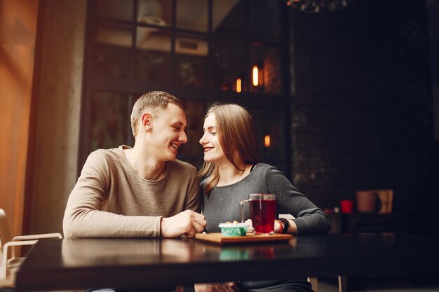 Young and loving couple sitting in a cafe