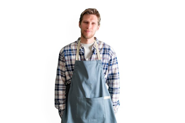 A young male chef cook put with apron portrait, isolated white background