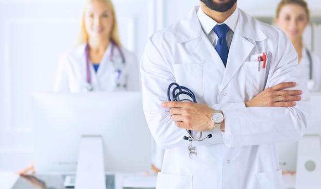 Young male doctor in front of medical group