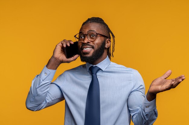 Young male entrepreneur speaking on the smartphone