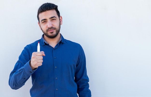 young male holding pen teaching and describing as teacher for student on white background