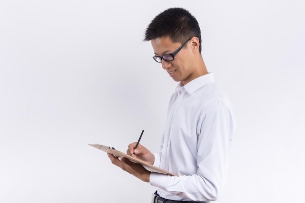 A young male holds a form in his hand