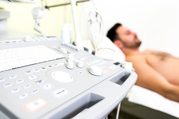 Young male patient in the ultrasound examination at hospital