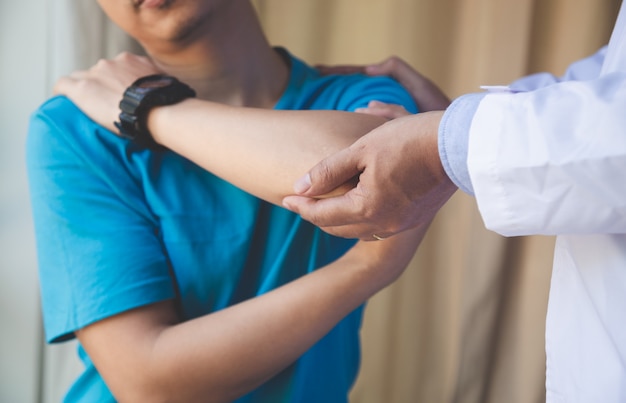 Young male patient visiting experienced doctor