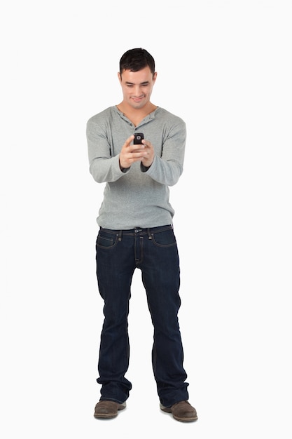 Young male reading text message