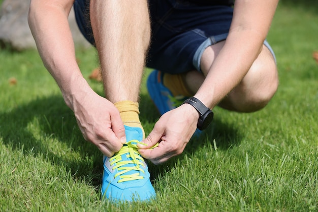 Young male runner getting ready to start