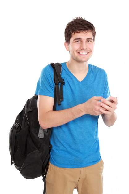 Young male smiling using mobile phone