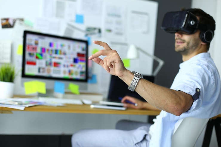 Photo young male software programmer testing a new app with 3d virtual reality glasses in office