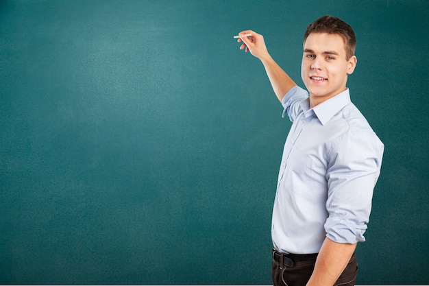 Young male teacher   standing in class