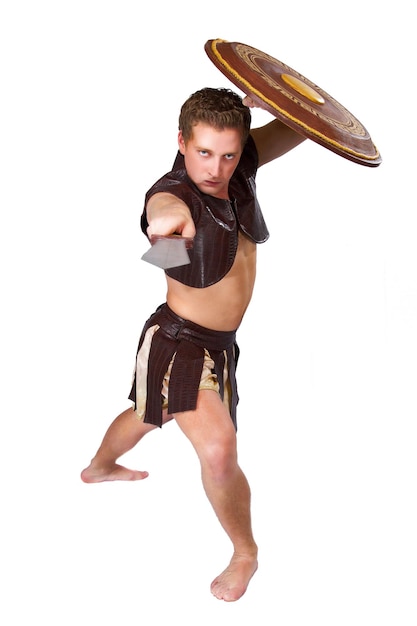 Photo a young male warrior with a shield