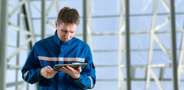 A young male worker portrait in the uniform