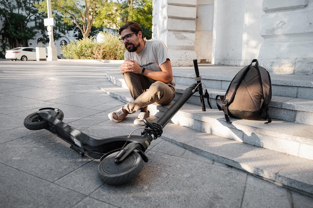 Young Man Accident With An Electric Scooter On Street