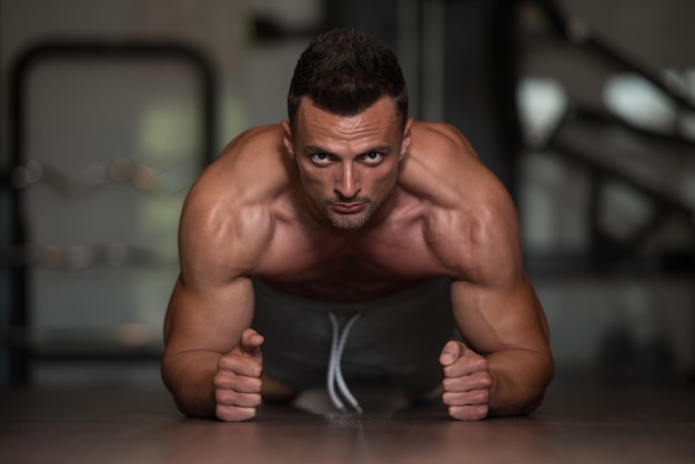 Young Man Athlete Doing Pushups As Part Of Bodybuilding Training