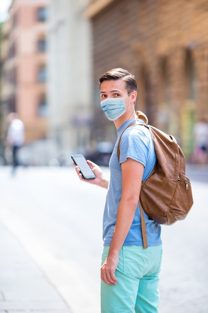 Young man background the old european city take selfie