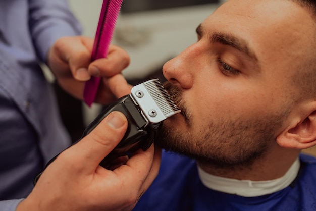 Young Man in Barbershop Hair Care Service Concept Selective focus High quality photo