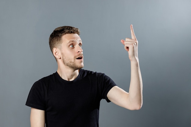 A young man on black background