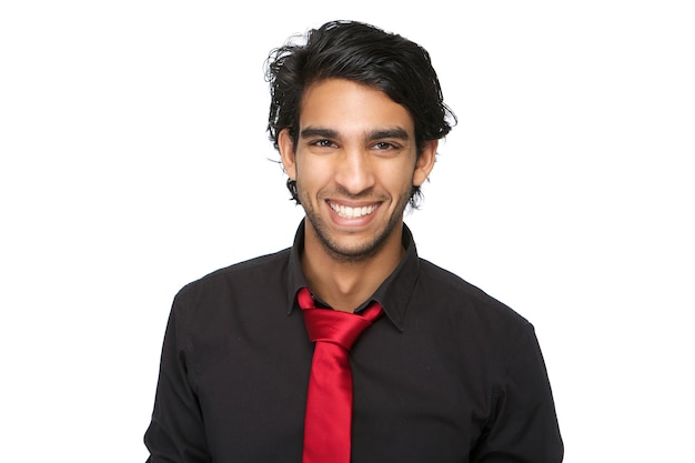 Young man in black shirt and tie laughing