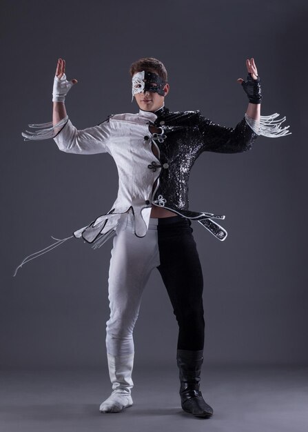 Young man in black and white fancy dress