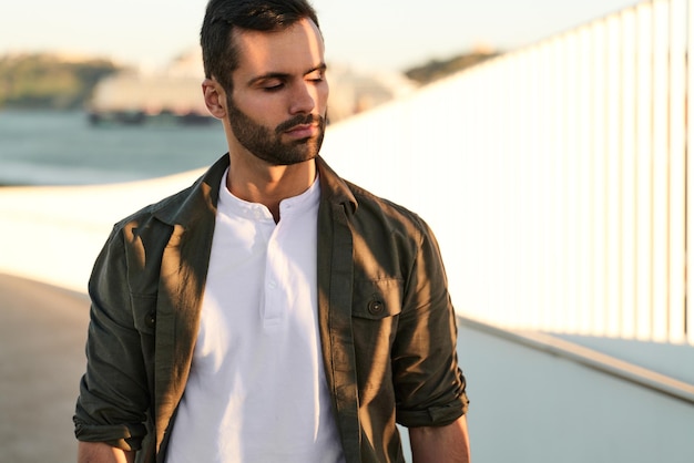 Young man under bright sunlight