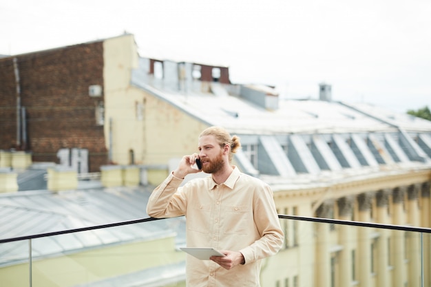 Young man busy on the phone