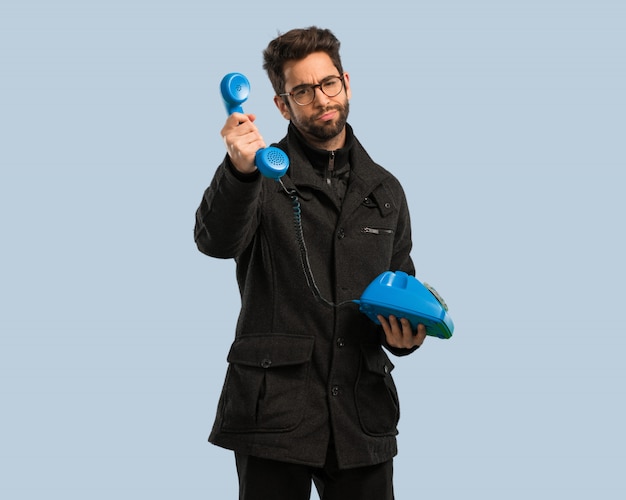 Young man calling by phone