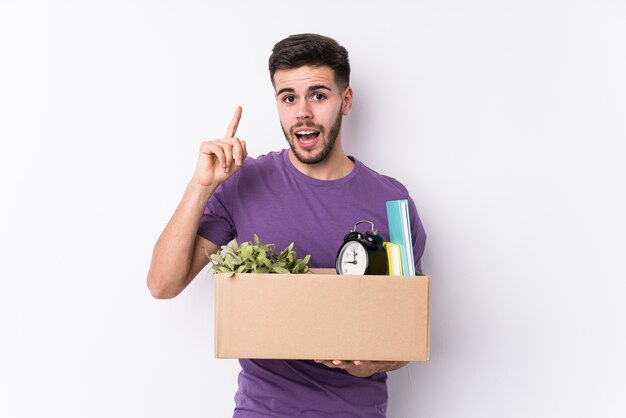 Young man carrying a box