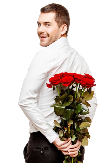 Young man carrying flowers